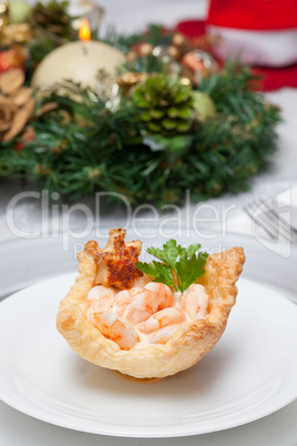 Shrimp cocktail in the puff pastry on christmas table