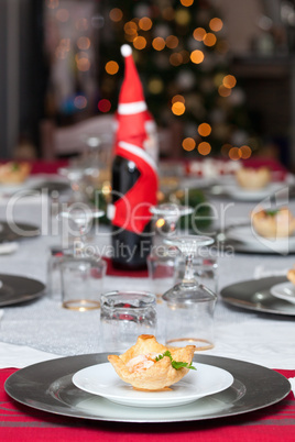 Shrimp cocktail in the puff pastry on christmas table