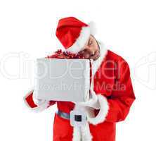 Young Santa Claus with gift box