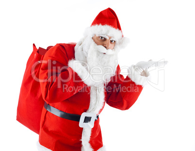 Young Santa Claus pointing on white background