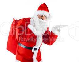 Young Santa Claus pointing on white background