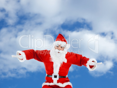 Santa Claus mimics a plane while flying
