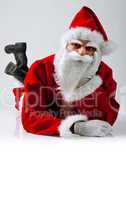 Santa Claus lying down with serious expression
