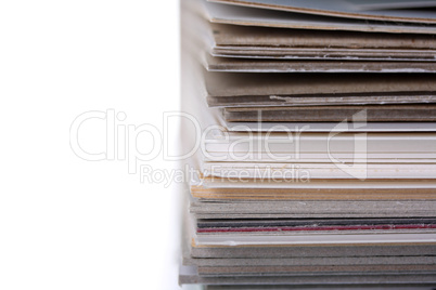 separating stacked sheets to organize a folder with white background