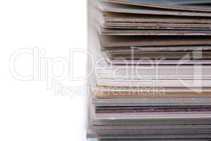 separating stacked sheets to organize a folder with white background
