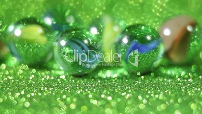 Glittering green marble balls