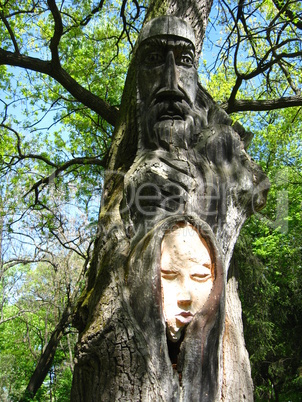 sculpture of personage cut out from a tree