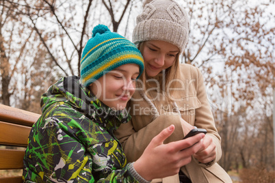 happy couple reading a mobile text message.