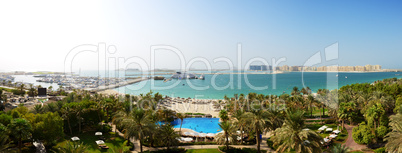 panorama of beach with a view on jumeirah palm man-made island,