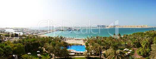 panorama of beach with a view on jumeirah palm man-made island,