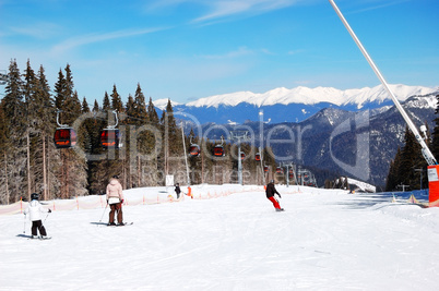 jasna-march 15: skiers rides on a slope in jasna low tatras. it