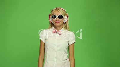 beautiful blond woman wearing headphones