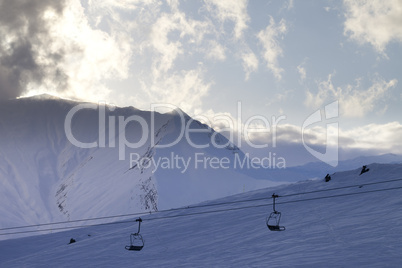 ski slope and chair-lift in evening