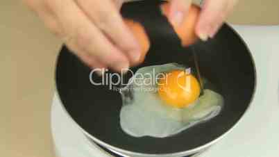 Cracking Egg In Frypan
