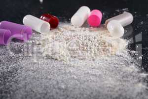 macro shot of powder by open pills