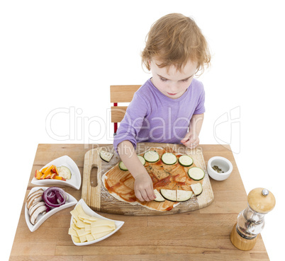 child making fresh pizza