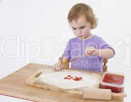 girl making pizza