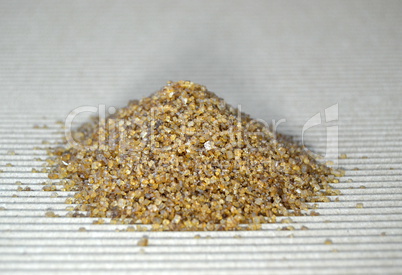 Pile of brown sugar on a table