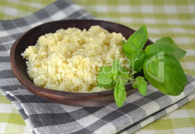 couscous in a wooden bowl