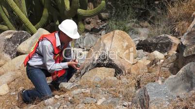 geologist man rock sample
