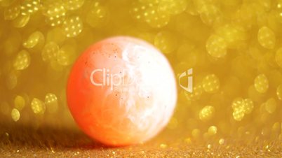 Ball over golden background
