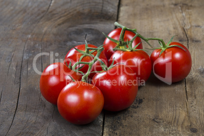 tomatoes on rustic wooden table