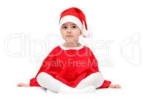child in santa claus hat sitting on white