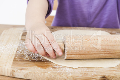 child baking pie