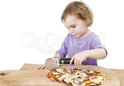 cute girl cutting fresh homemade pizza