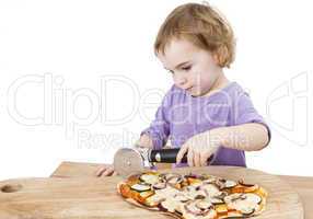 cute girl cutting fresh homemade pizza