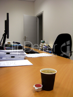 paper glass of coffee and two cream portion