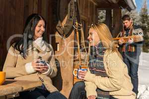 friends spend holiday winter snow cottage