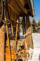 snow winter cottage from outside ski poles