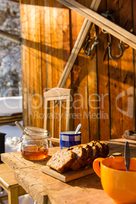 snow winter cottage breakfast on wooden table