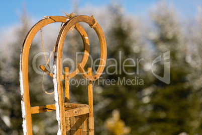 close-up of wooden sledge standing snow winter