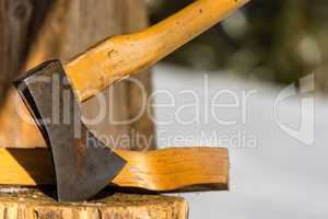 ax stuck in block of wood winter