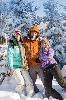 three friends enjoy snow winter holiday mountains