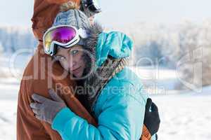 young couple ski goggles embrace winter snow