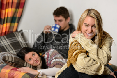 young friends spend winter holiday cozy cottage