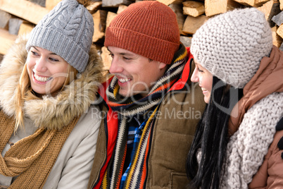 three friends laughing winter outdoor clothes