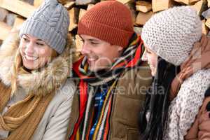 three friends laughing winter outdoor clothes