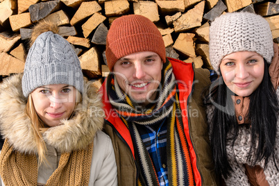 three friends wearing winter clothes outdoor