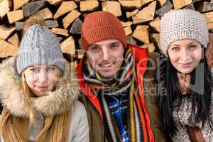 three friends wearing winter clothes outdoor