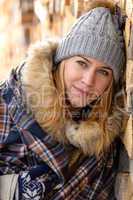 young woman in winter jacket cover blanket