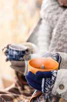 steaming cups of tea winter hands holding