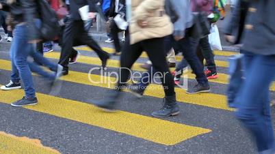 people crossing street on zebra stripes in Zurich