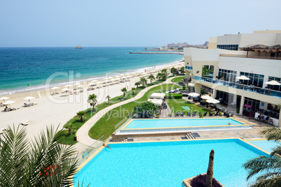 the beach and swimming pools at luxury hotel, fujairah, uae