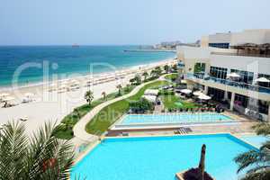 the beach and swimming pools at luxury hotel, fujairah, uae