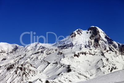 mount kazbek at sun winter day