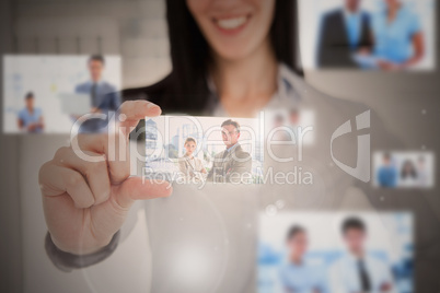 Close up of a business card being held by a woman